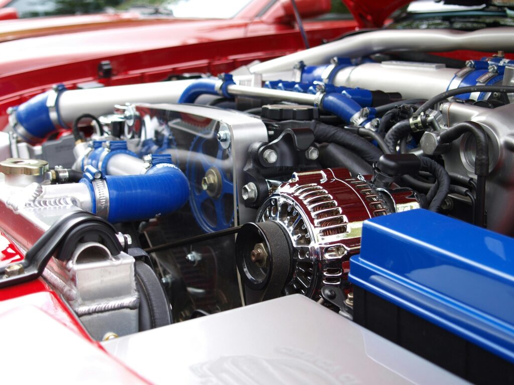 High-performance car engine with blue hoses and components