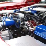 High-performance car engine with blue hoses and components