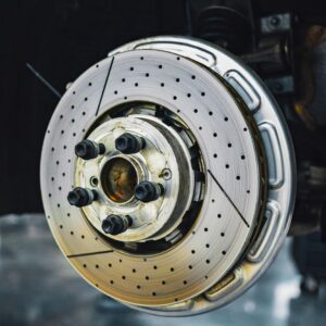 Close-up of ventilated brake rotor with drilled holes